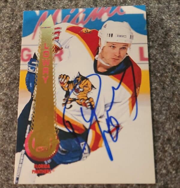 This is a 1994-95 Pinnacle trading card of Dave Lowry from the Florida Panthers, autographed by Dave Lowry