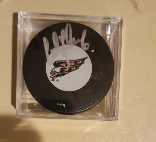 Calle Johansson Autographed Puck